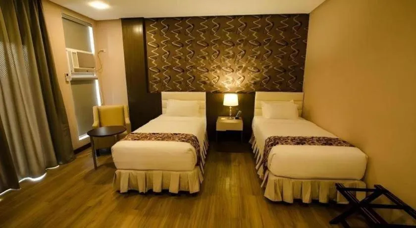 Bed in Oryza Hotel