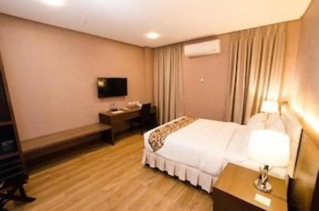 Bed in Oryza Hotel