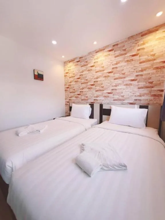 Bed in Rainbow Sky Hotel Samet