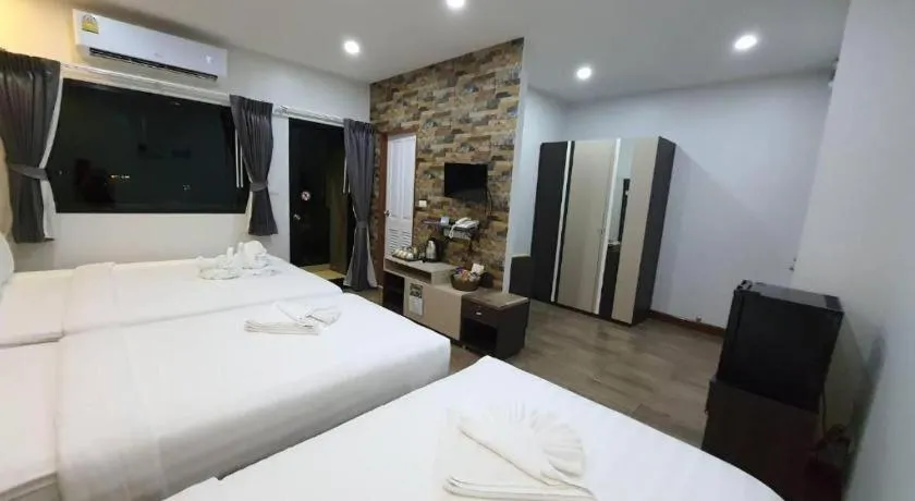 Bed in Rainbow Sky Hotel Samet