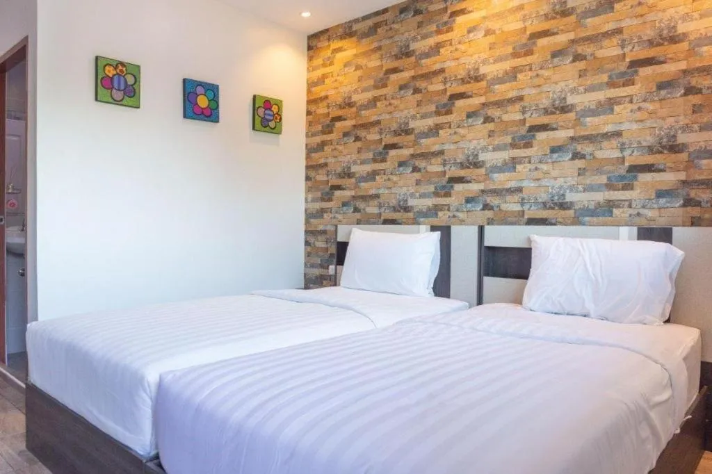 Bed in Rainbow Sky Hotel Samet