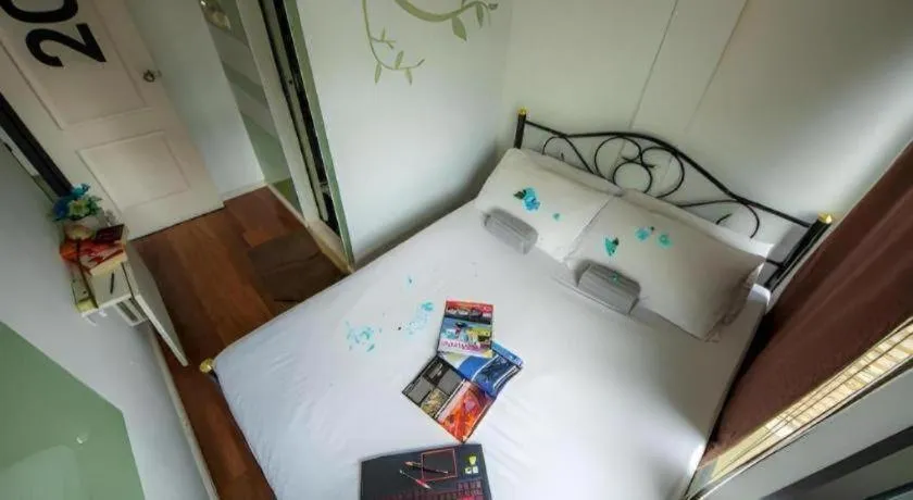 Bed in The Chilli Bangkok Hotel