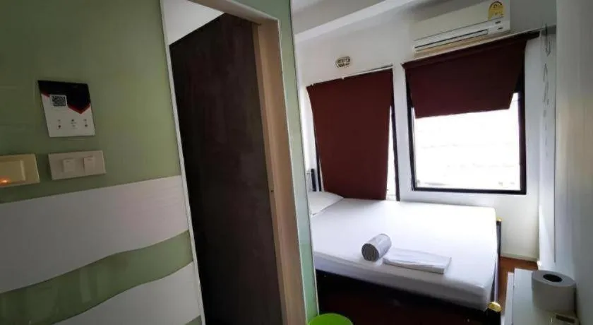 Bed in The Chilli Bangkok Hotel