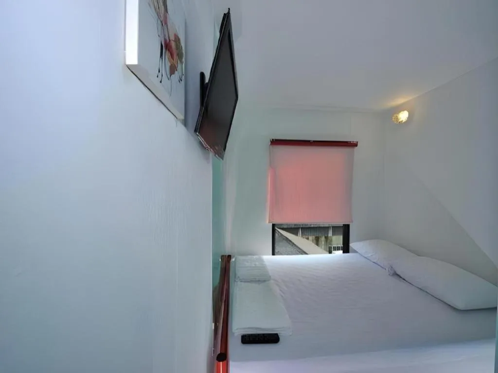 Bed in The Chilli Bangkok Hotel