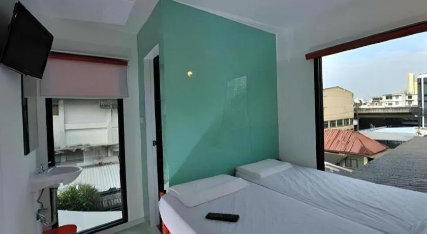 Bed in The Chilli Bangkok Hotel