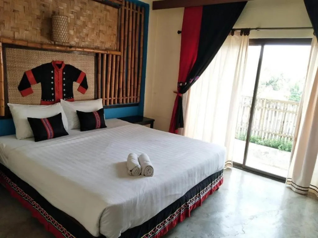 Bed in Phumanee Home Hotel