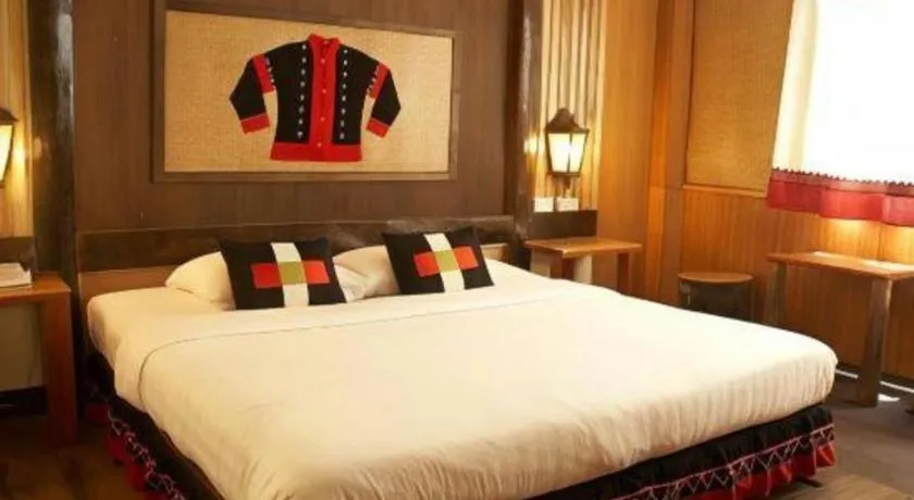 Bed in Phumanee Home Hotel