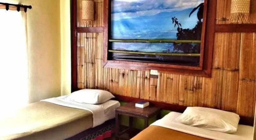 Bed in Phumanee Home Hotel