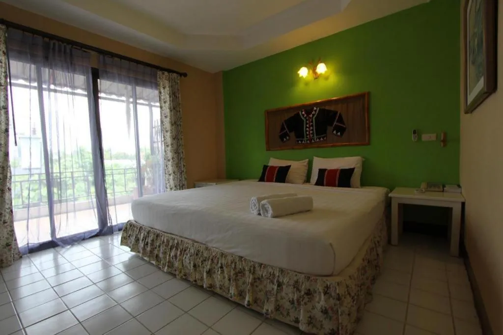 Bed in Phumanee Home Hotel