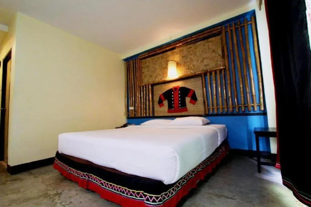Bed in Phumanee Home Hotel
