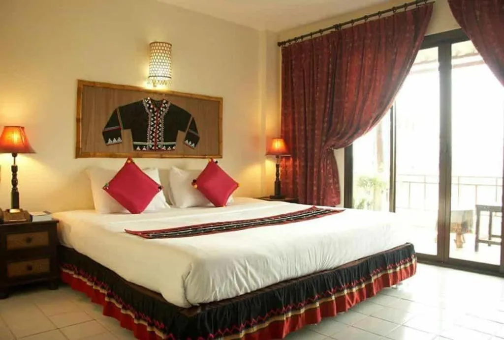 Bed in Phumanee Home Hotel