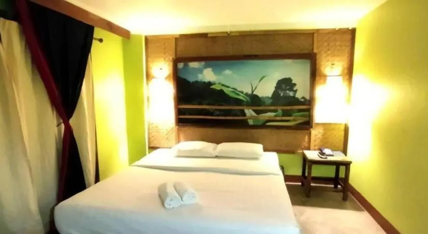 Bed in Phumanee Home Hotel