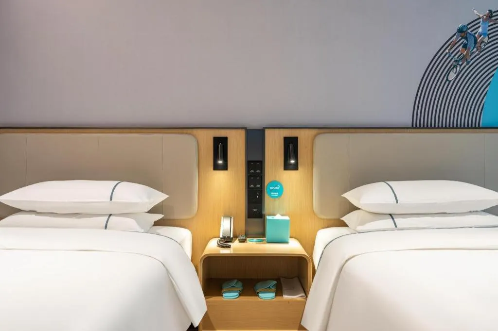 Bed in City Comfort Inn Jiangmen Xinhui Xiangshan Park