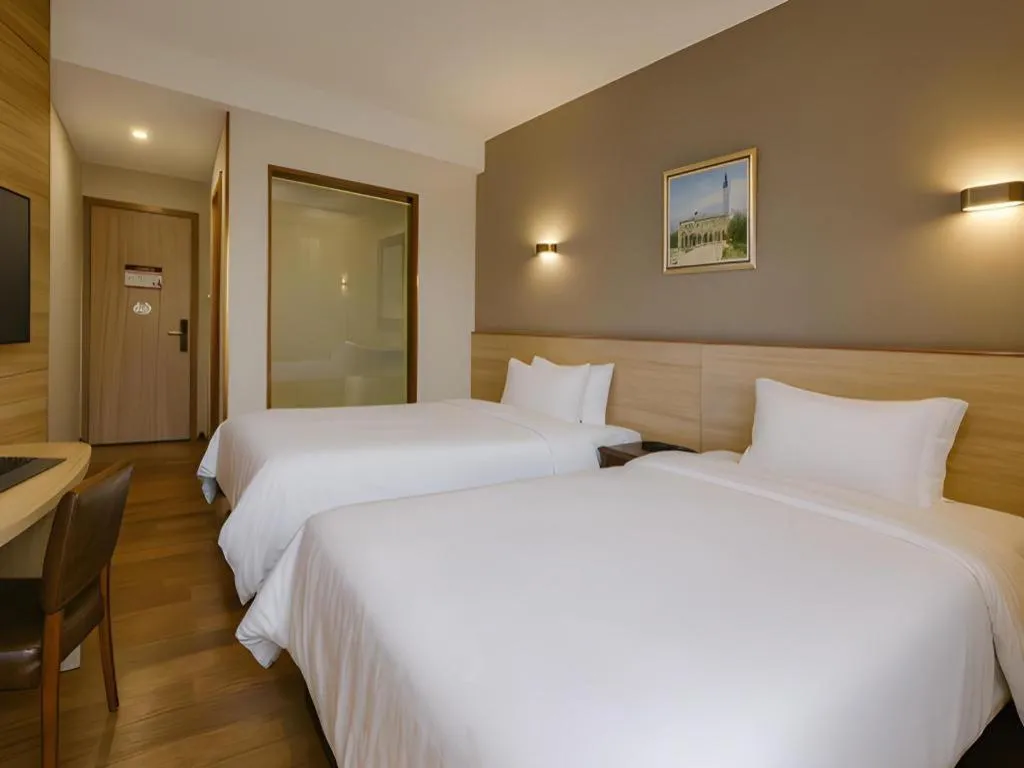 Bed in Hanyong Hotel Shenzhen International Exhibition Center