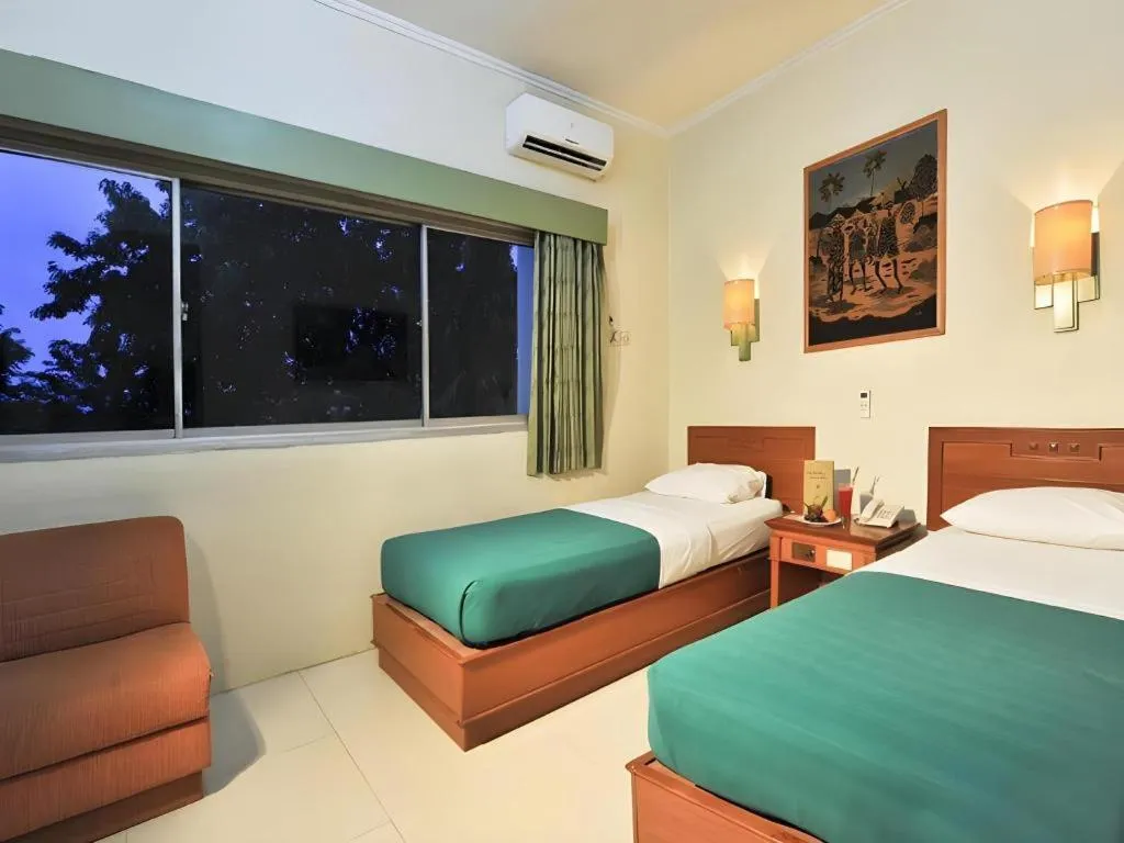 Bed in Muria Hotel