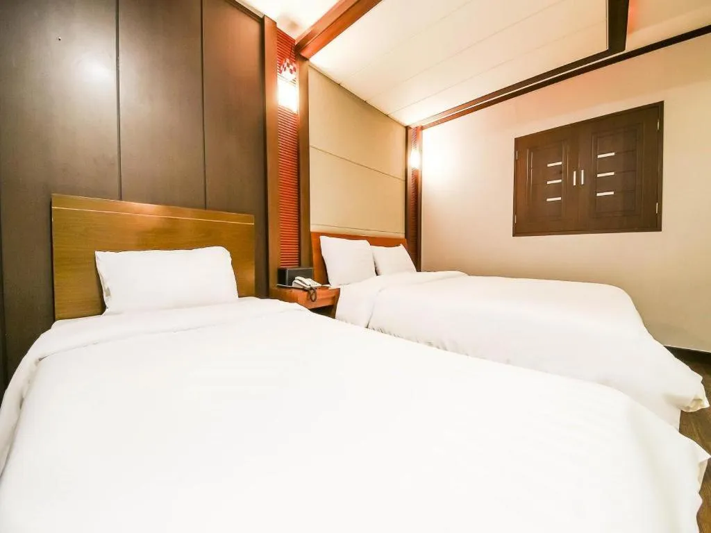 Bed in Hotel J Suwon