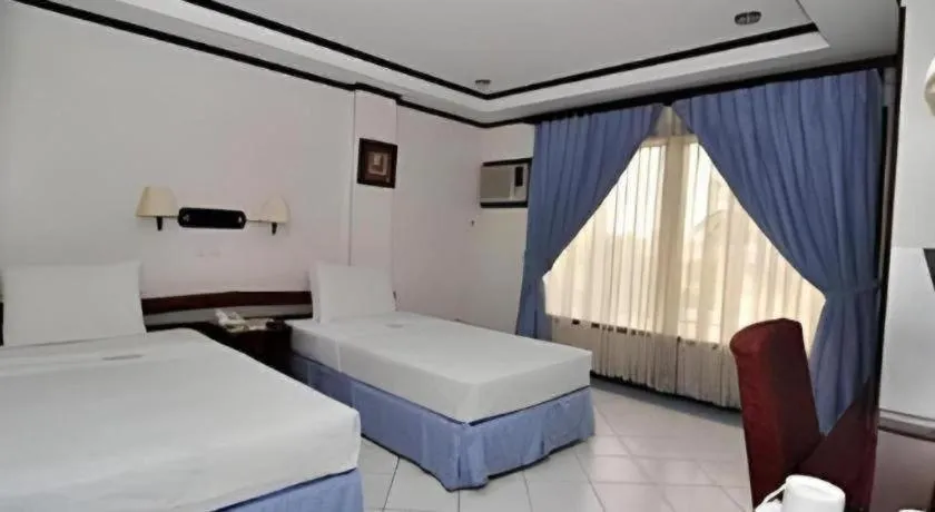 Bed in Soledad Suites