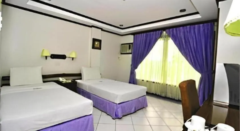 Bed in Soledad Suites