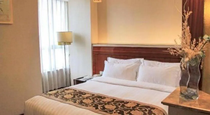 Bed in Jinrong International Hotel