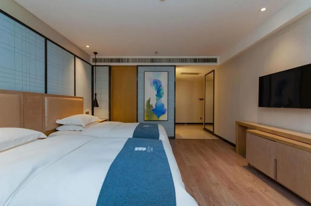 Bed in Echarm Hotel Guiyang International Convention & Exhibition Center