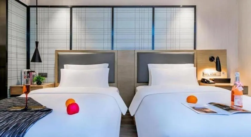Bed in Echarm Hotel Guiyang International Convention & Exhibition Center