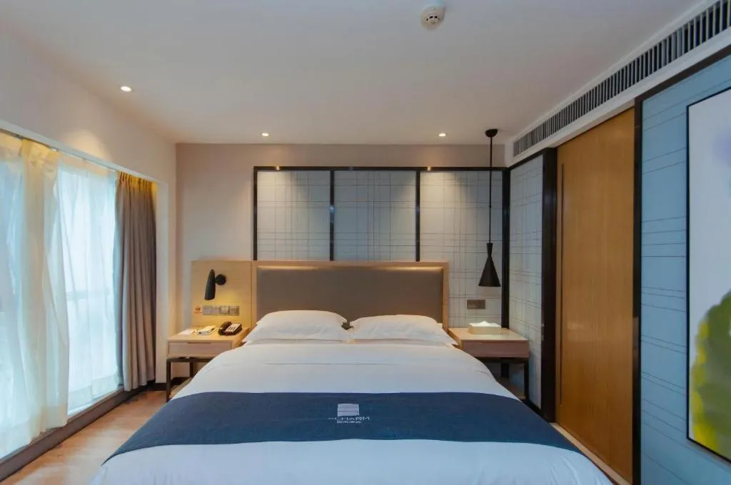 Bed in Echarm Hotel Guiyang International Convention & Exhibition Center