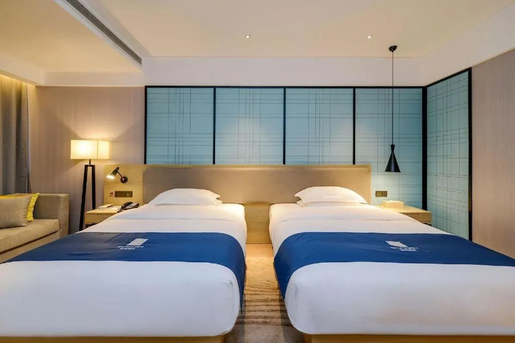 Bed in Echarm Hotel Guiyang International Convention & Exhibition Center