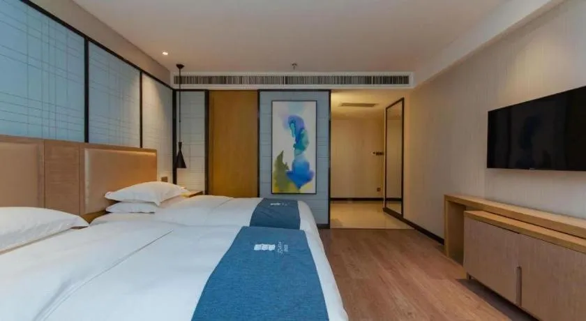 Bed in Echarm Hotel Guiyang International Convention & Exhibition Center