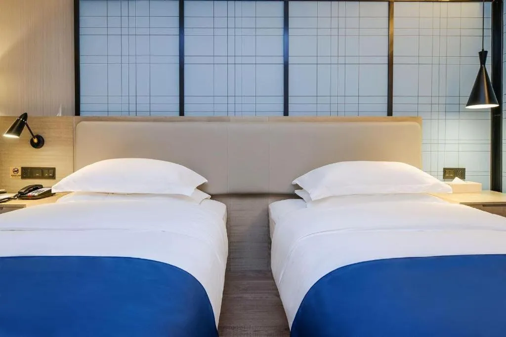 Bed in Echarm Hotel Guiyang International Convention & Exhibition Center