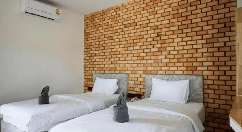 Bed in Nata Resort Chanthaburi II