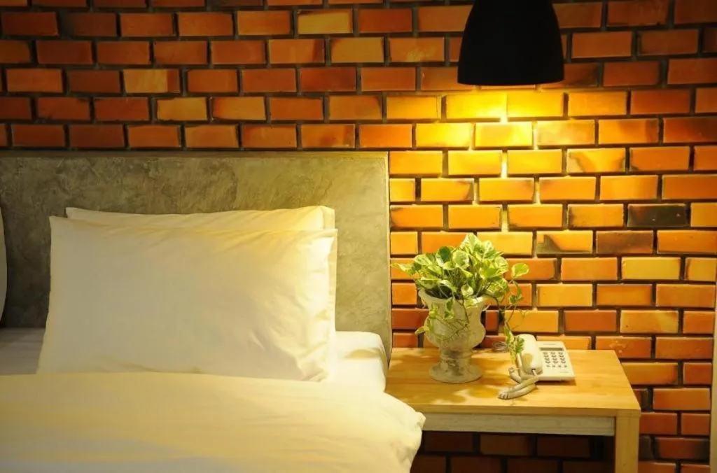 Bed in Nata Resort Chanthaburi II