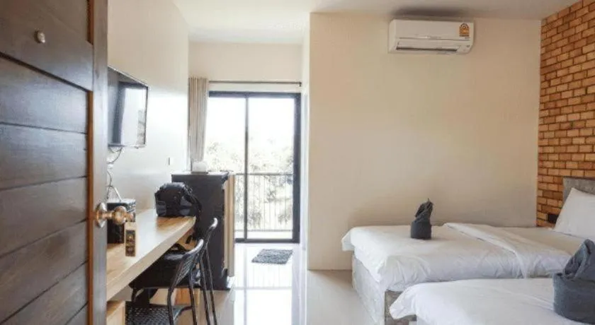 Bed in Nata Resort Chanthaburi II