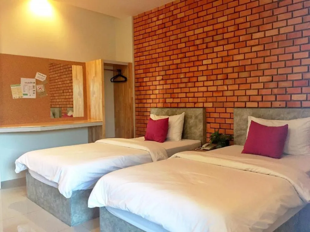 Bed in Nata Resort Chanthaburi II