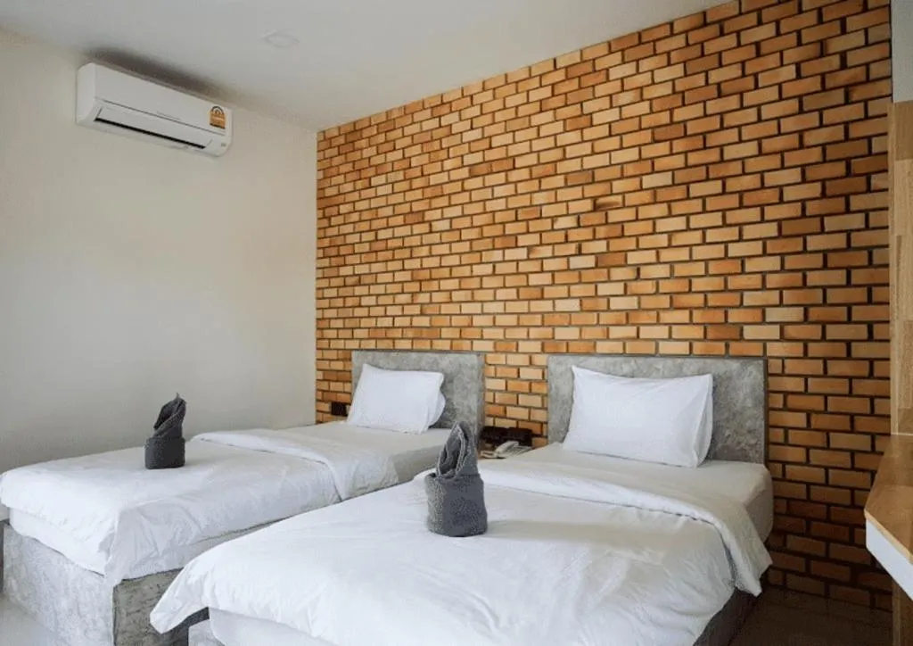 Bed in Nata Resort Chanthaburi II