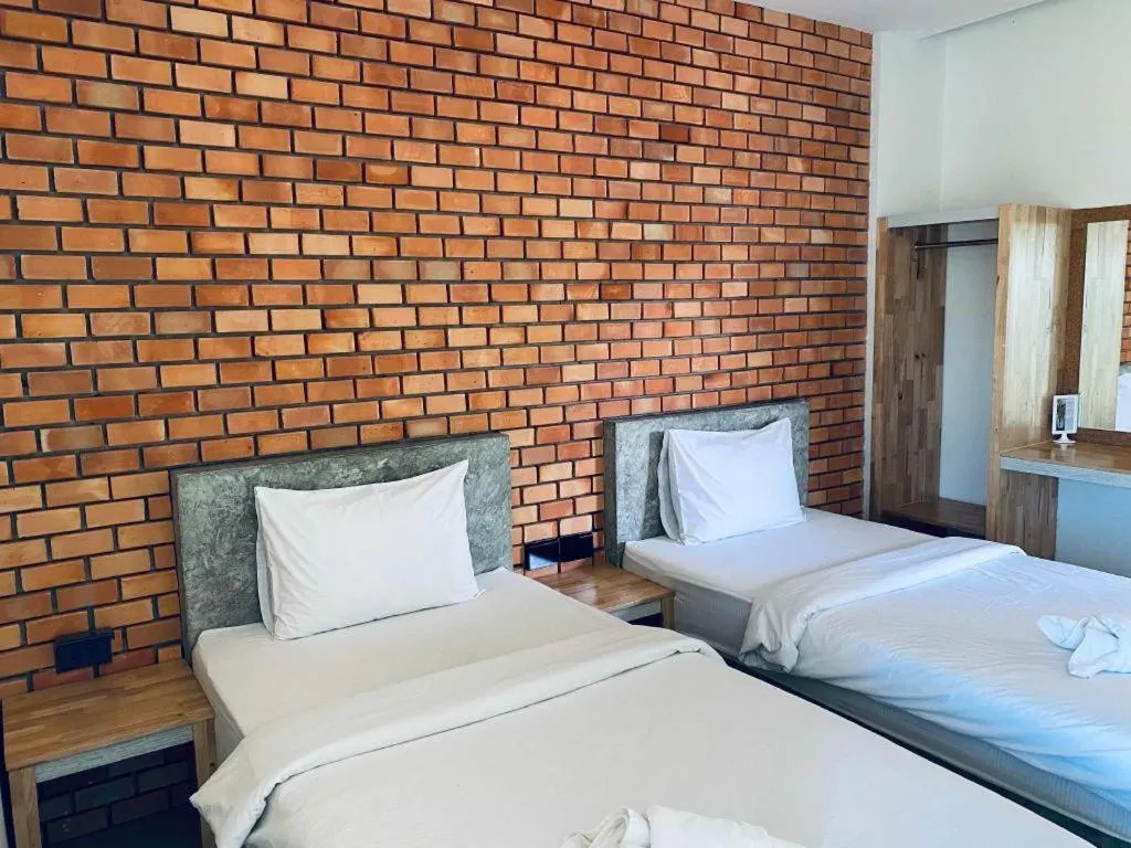 Bed in Nata Resort Chanthaburi II
