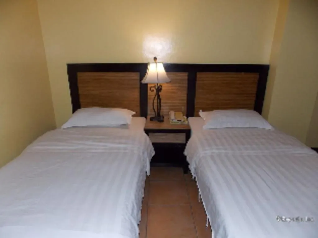 Bed in Planta Centro Bacolod Hotel & Residences