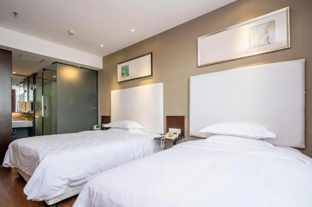 Bed in Xiamen Blue Peninsula Hotel