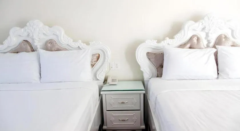 Bed in Hoa Sen Vang Hotel Dalat