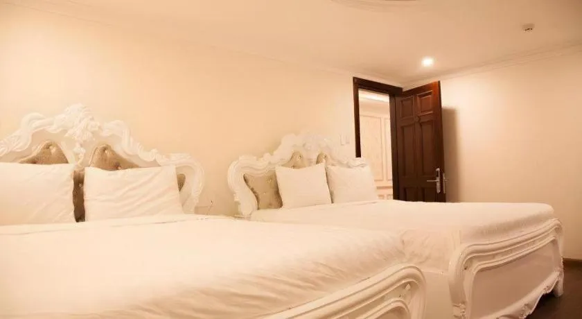 Bed in Hoa Sen Vang Hotel Dalat