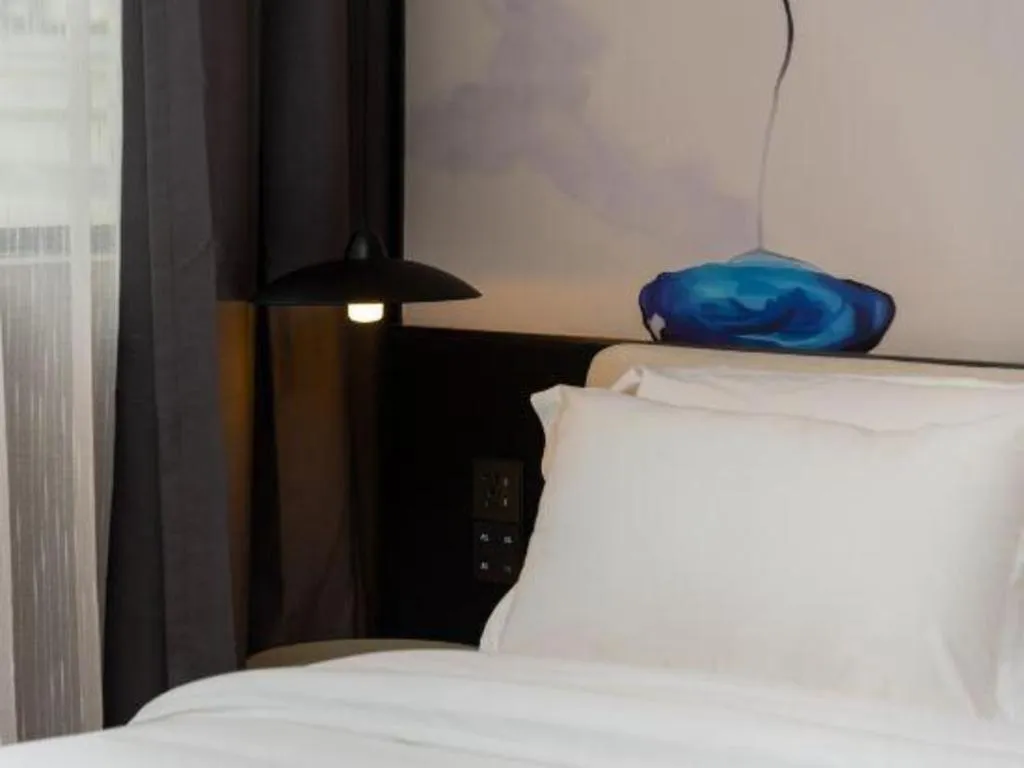 Bed in Bravo Business Hotel