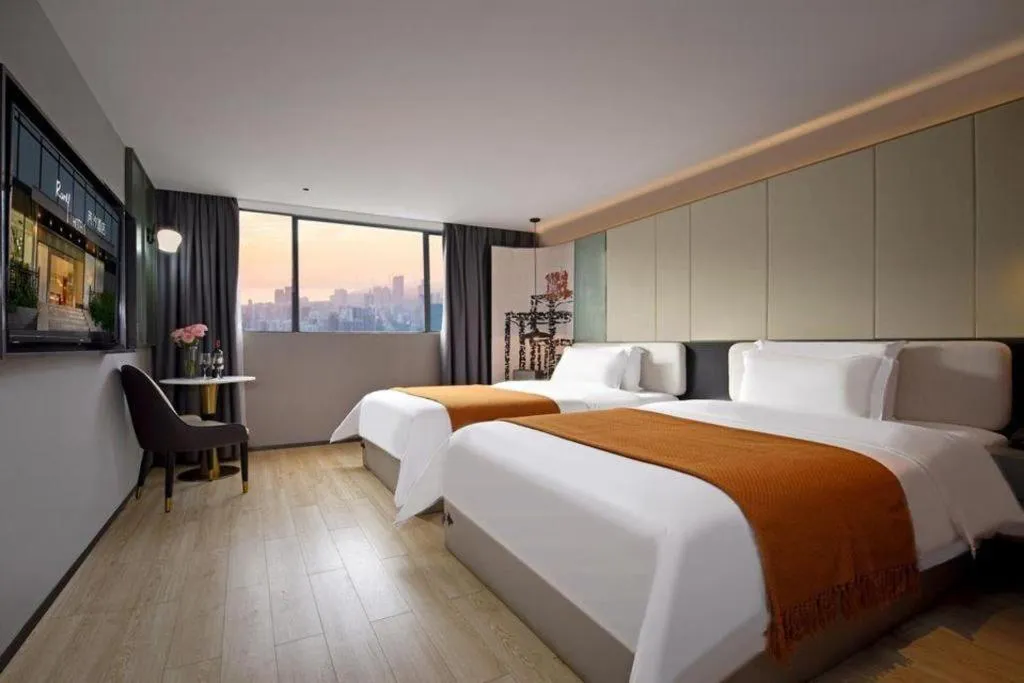 Bed in Bravo Business Hotel