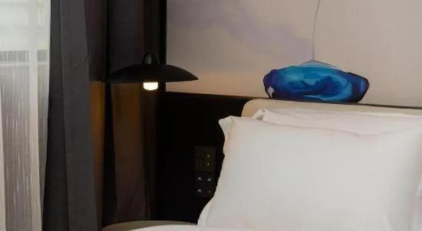 Bed in Bravo Business Hotel