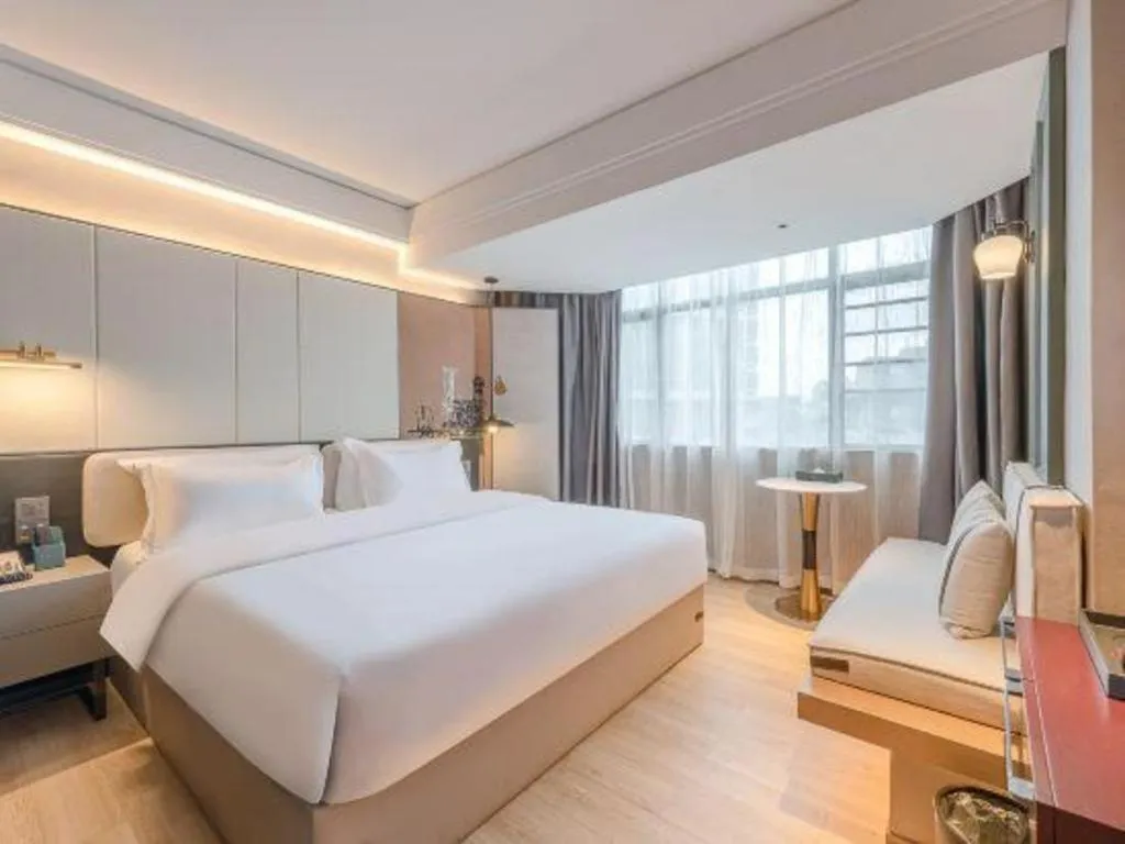 Bed in Bravo Business Hotel