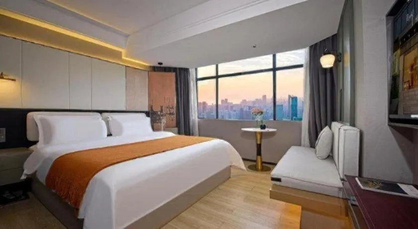 Bed in Bravo Business Hotel