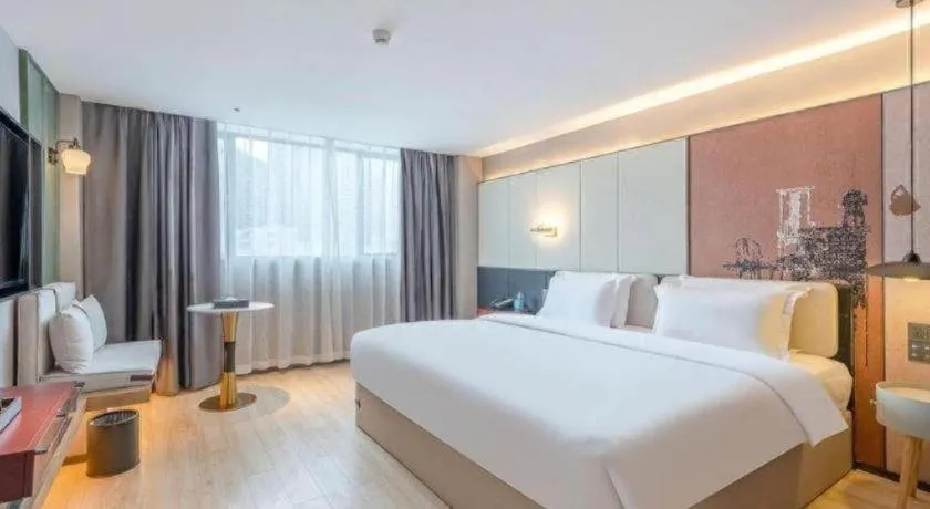 Bed in Bravo Business Hotel