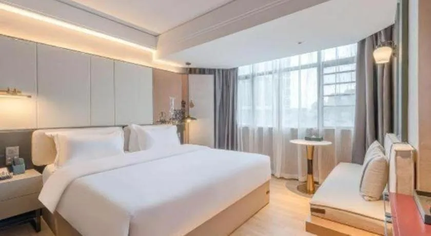 Bed in Bravo Business Hotel