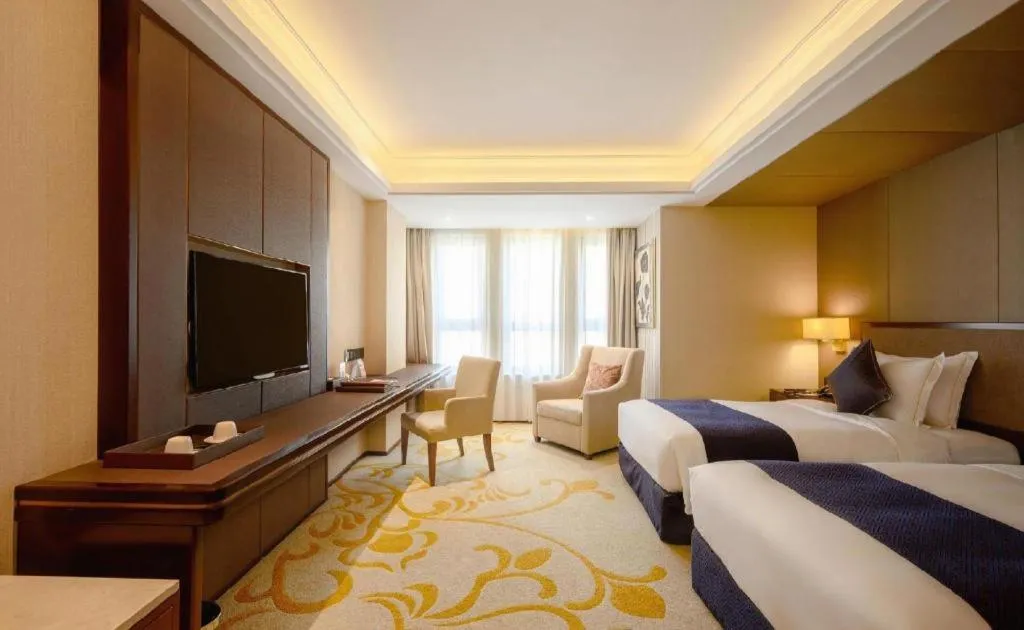 Bed in Sky World Hotel Qingdao