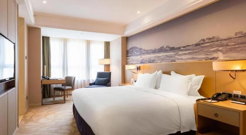 Bed in Sky World Hotel Qingdao