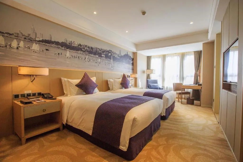 Bed in Sky World Hotel Qingdao