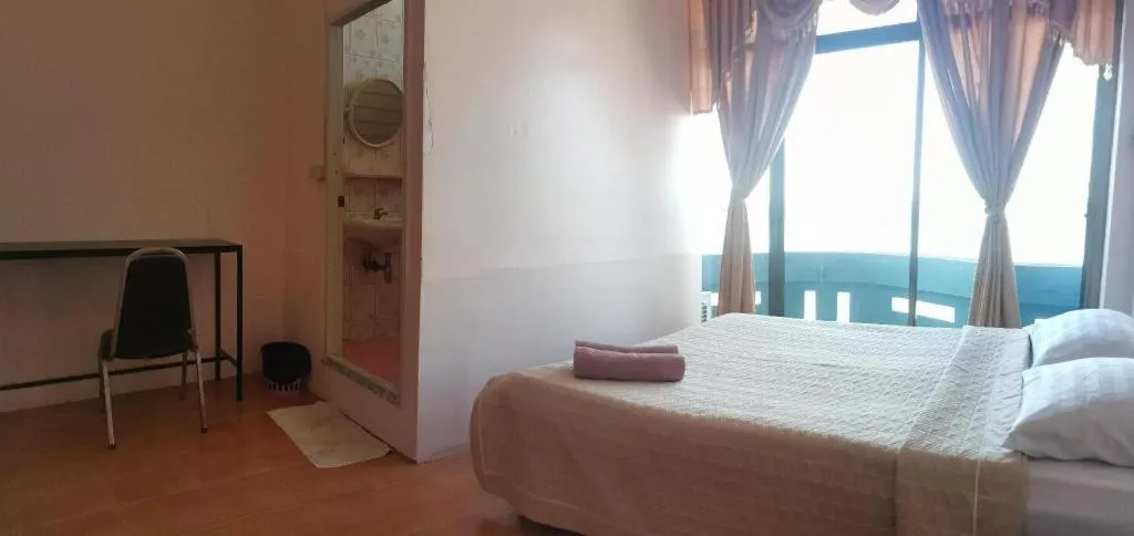 Bed in Just Mansion Hotel